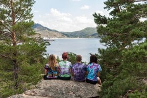 Kids sitting on a rock